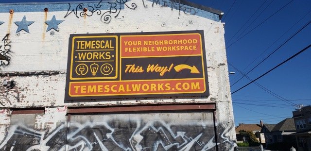 New Temescal Works billboard on side of our building