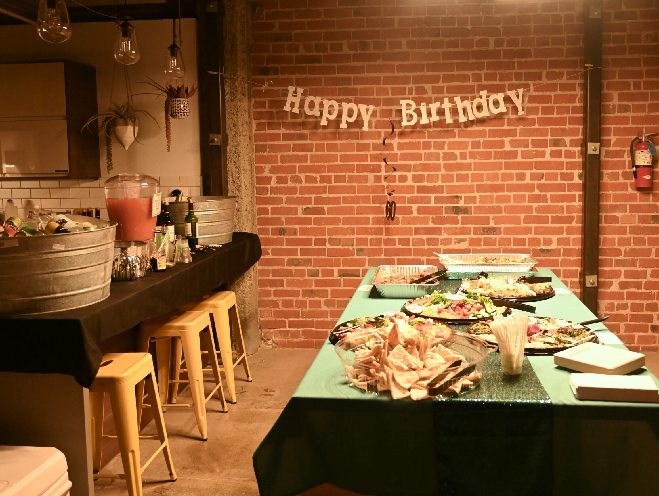 Happy Birthday table and decor. Our event space is highly configurable for celebrations, baby showers, school auctions, receptions, company off-sites and workshops, and for creating community.