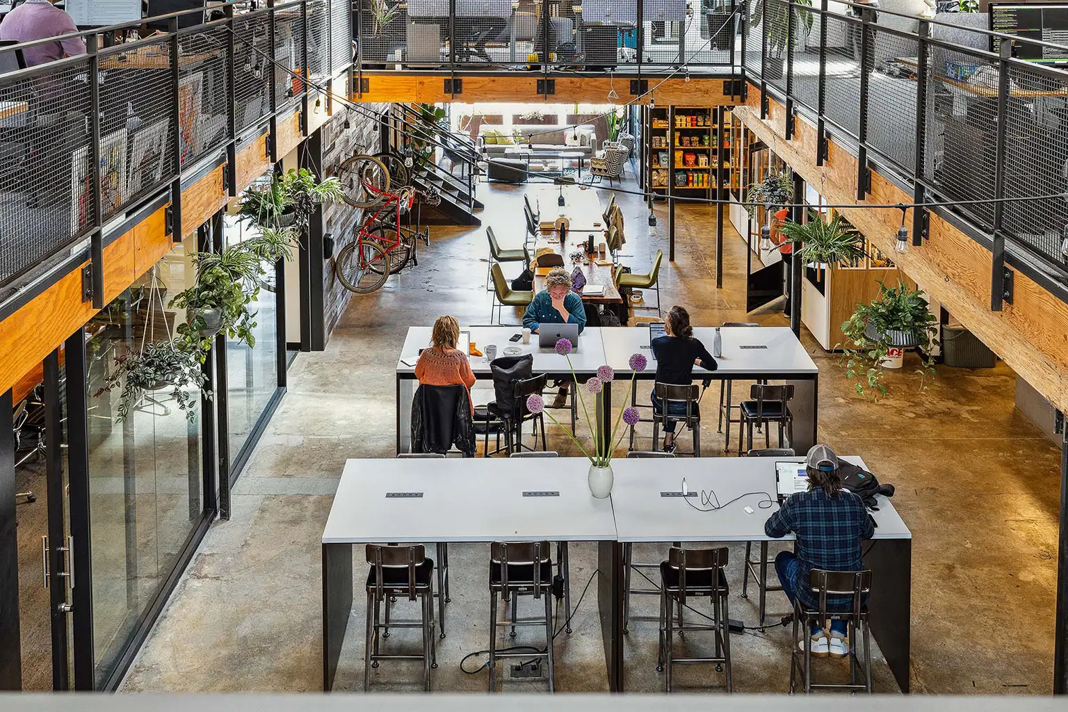 2ndfloorview view of temescal works first floor from second floor / various people working at desks on laptops